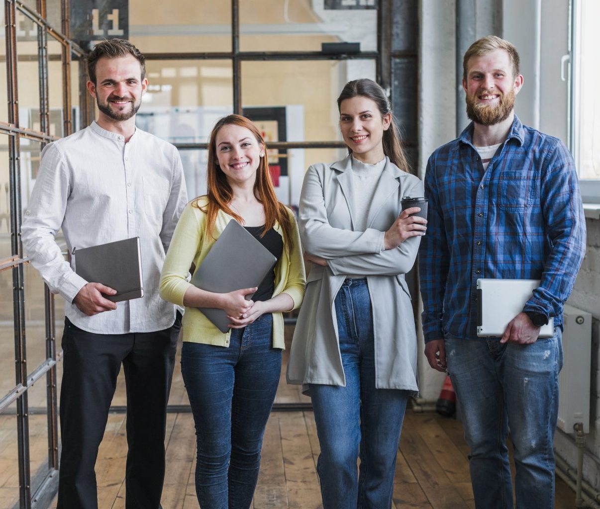 portrait-smiling-businesspeople-standing-office
